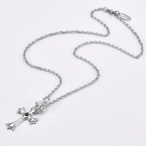 dark funeral cross pendant with a hand charm and white background